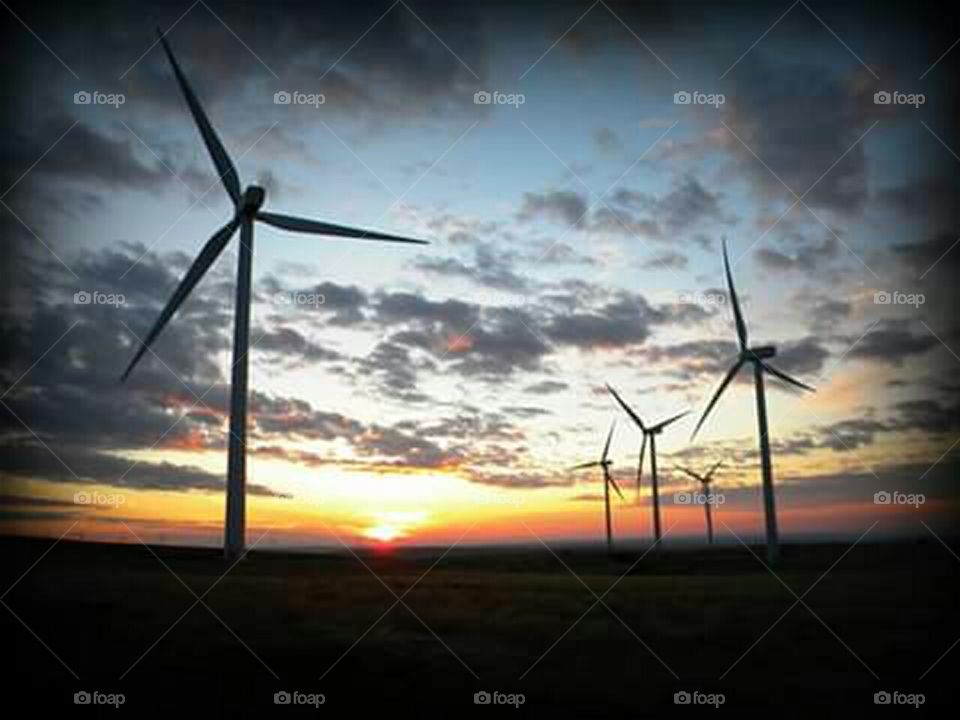wind energy windmills in the sunset