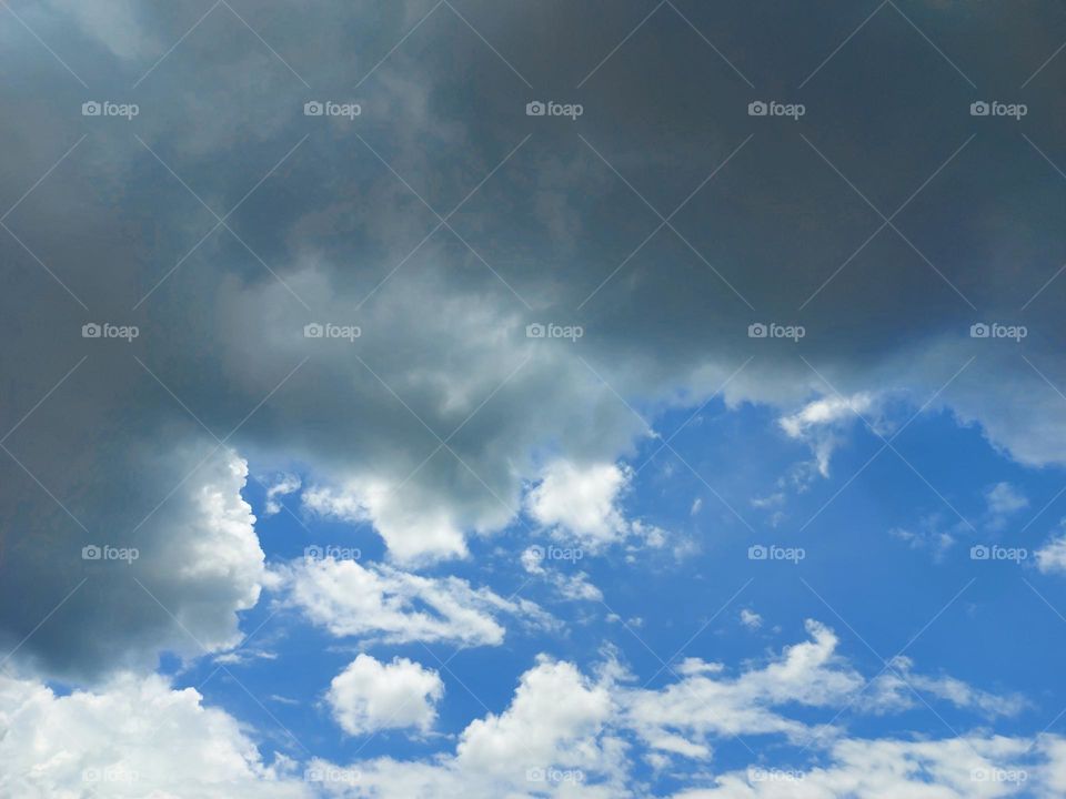 Bright clouds and dark clouds in the blue sky