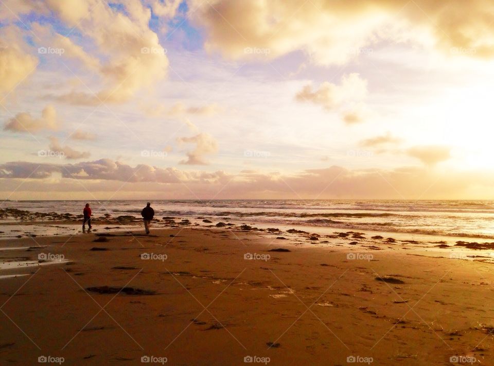 Romantic walk on a sunset beach 