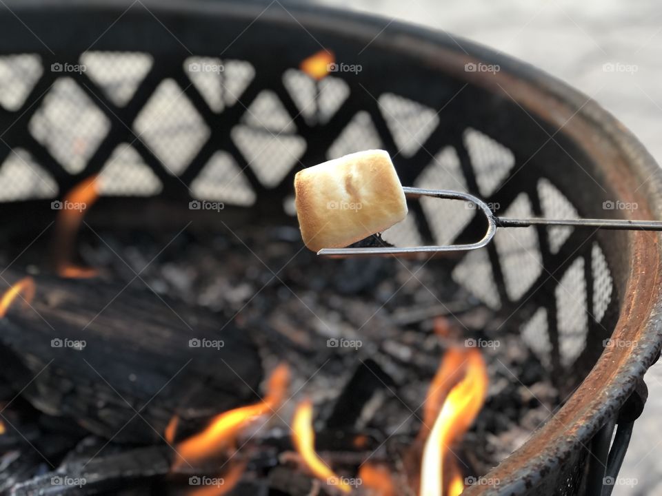 Marshmallow roasting over a fire