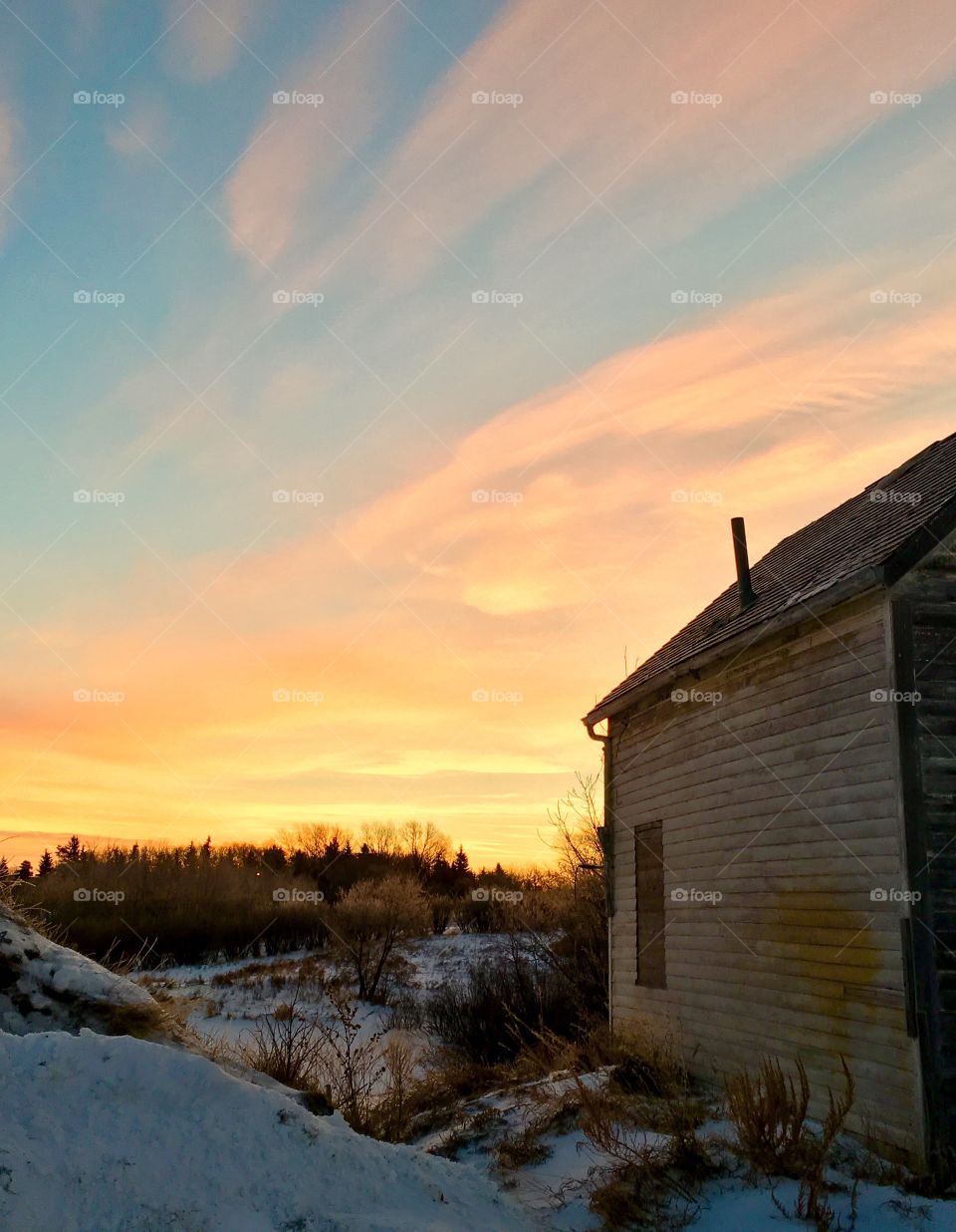 Old farm building on a winter morning 