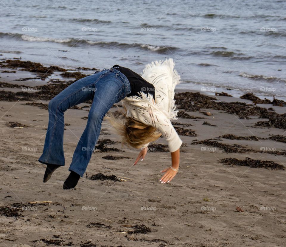 Aerobic ane yoga at the beach a Grey summerday .While we waiting for the sum