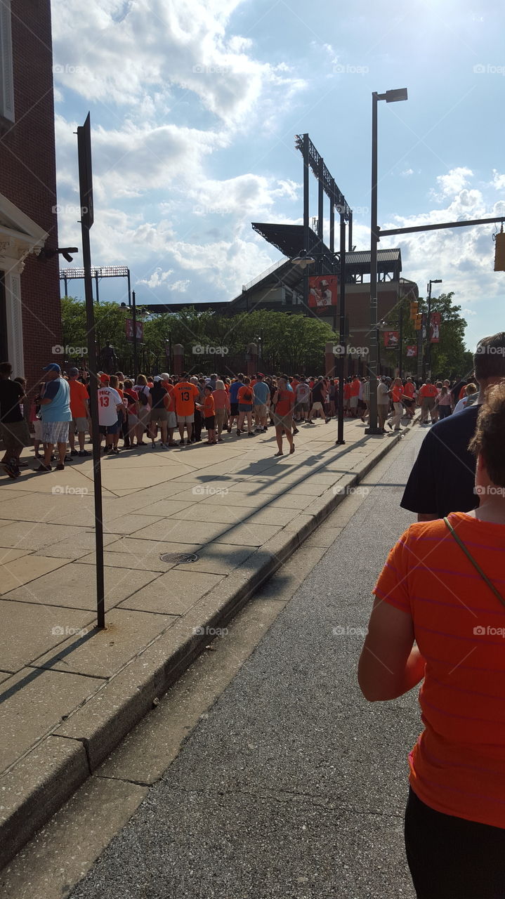 Waiting in line!. Oriole bird bobblehead night at the Yard