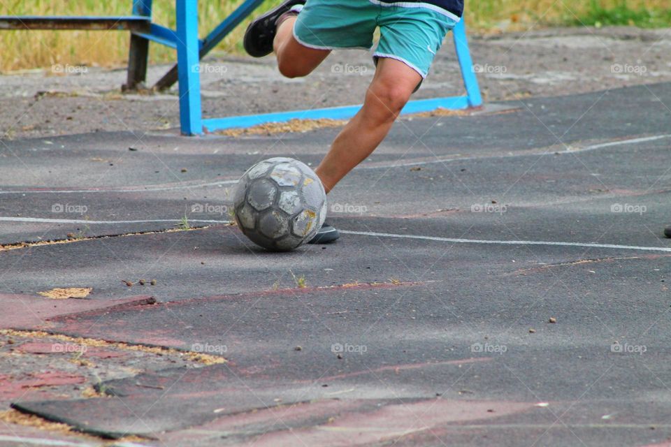 children in the old stadium playing football