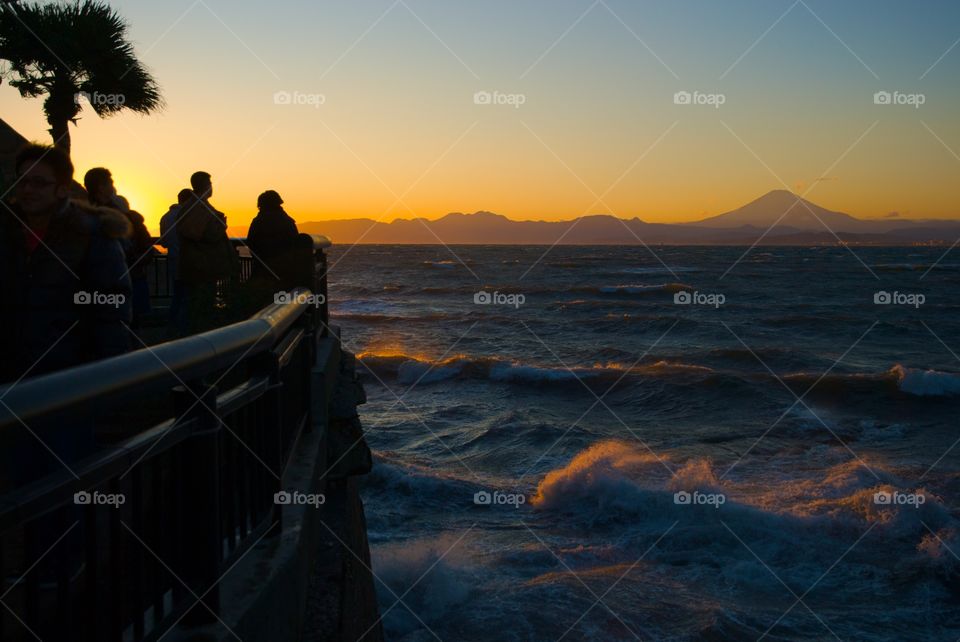 Photographers on Enoshima island shooting Mount Fuji at sunset