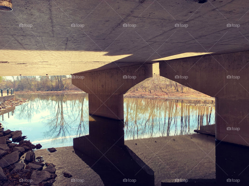 A bridge over muddied waters. But today, upon reflection, you could almost see to the bottom. 