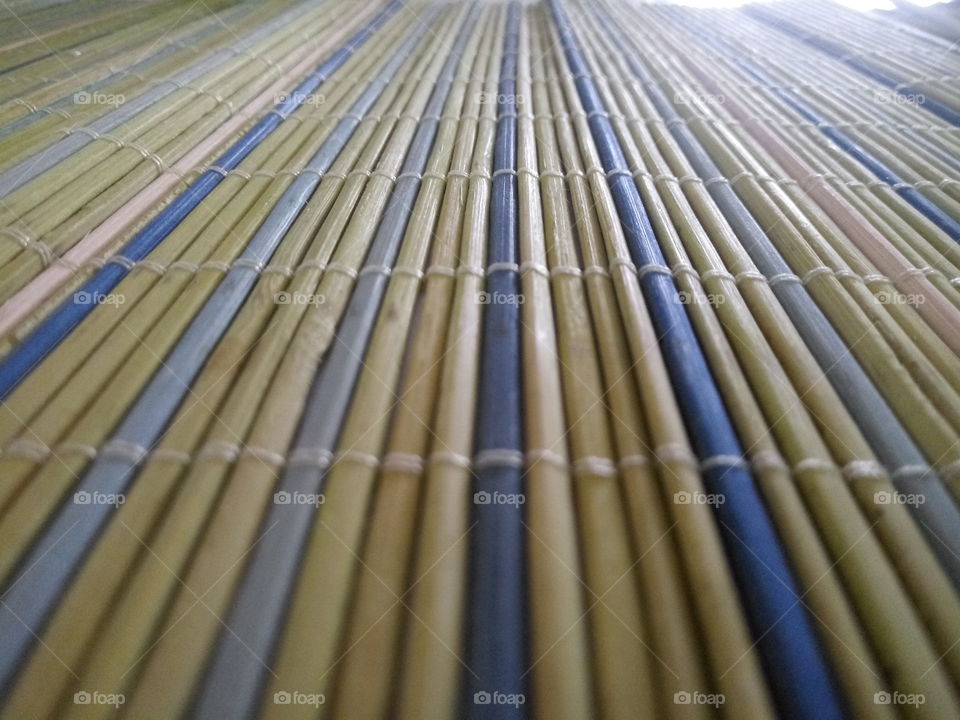 green and blue bamboo mat