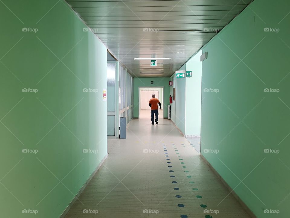 Hospital ward with man in the distance