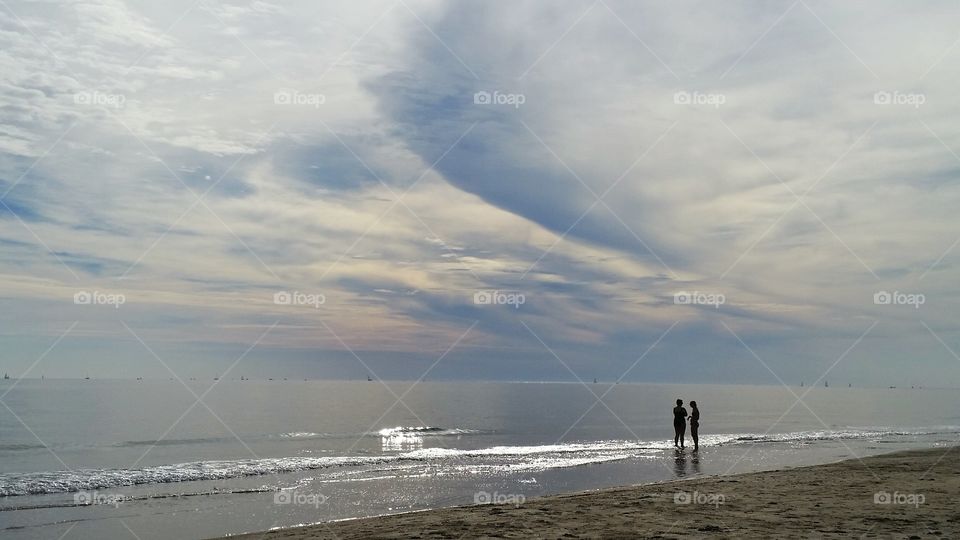 Silhouette of people at beach