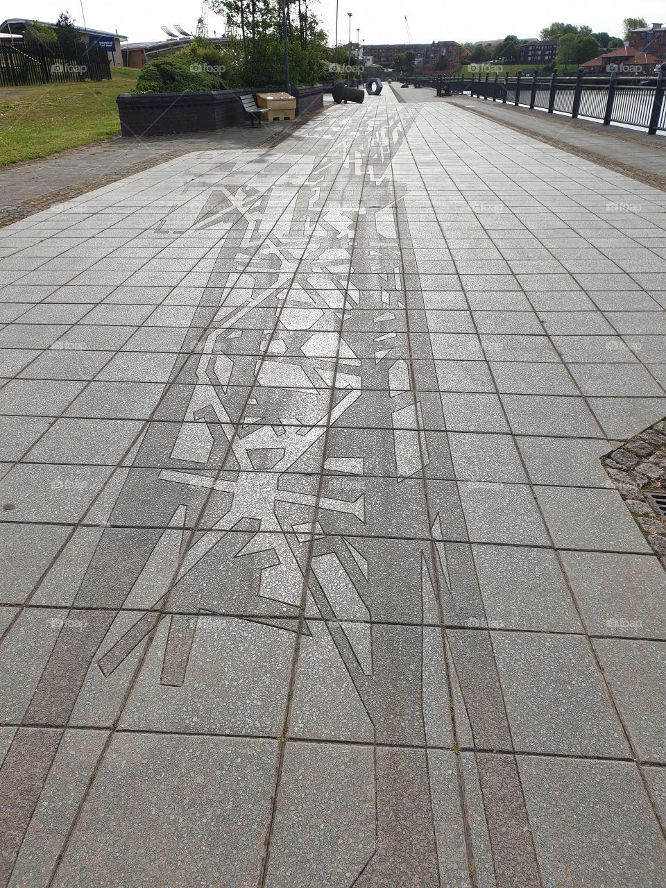 detailed pattern on paved walkway.
