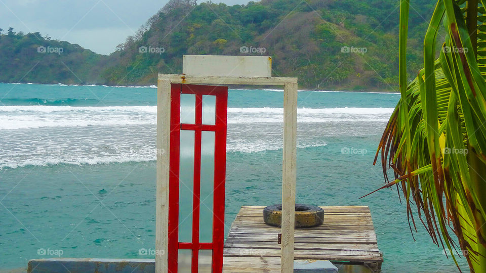 Red door by the ocean