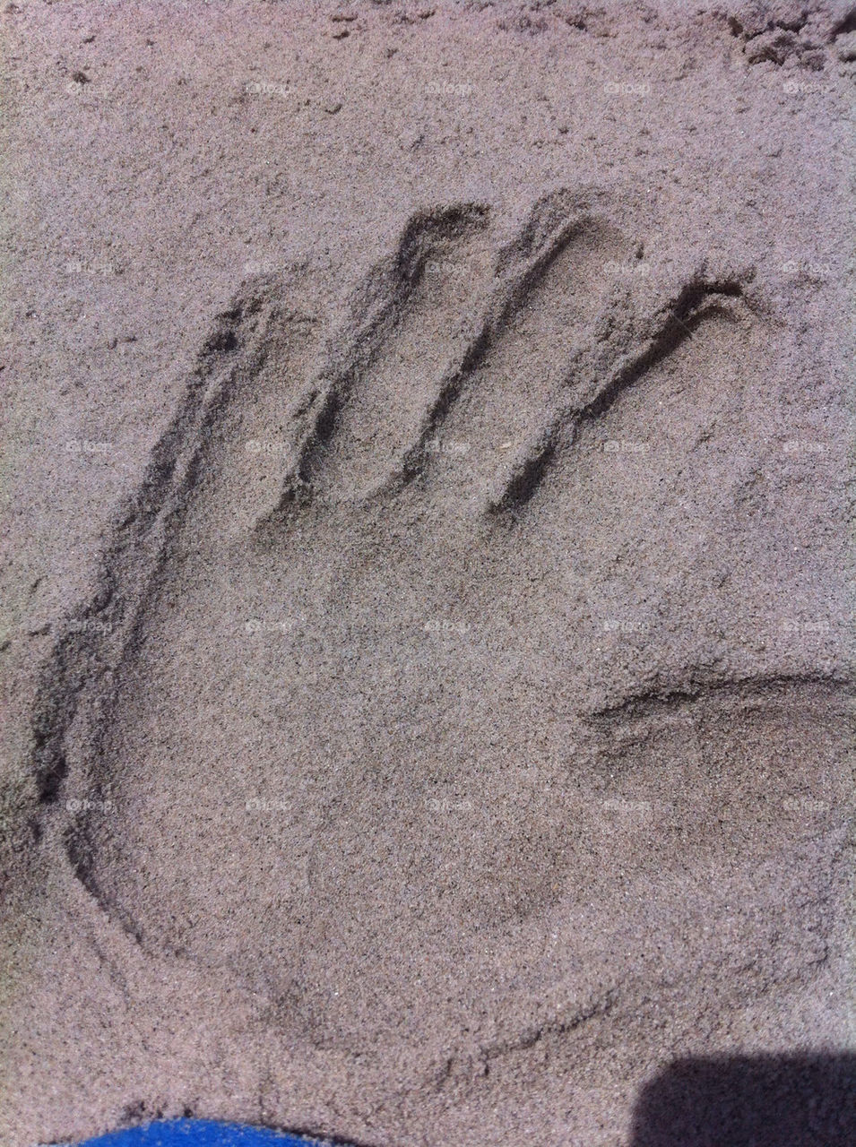 HAND PRINT IN THE SAND