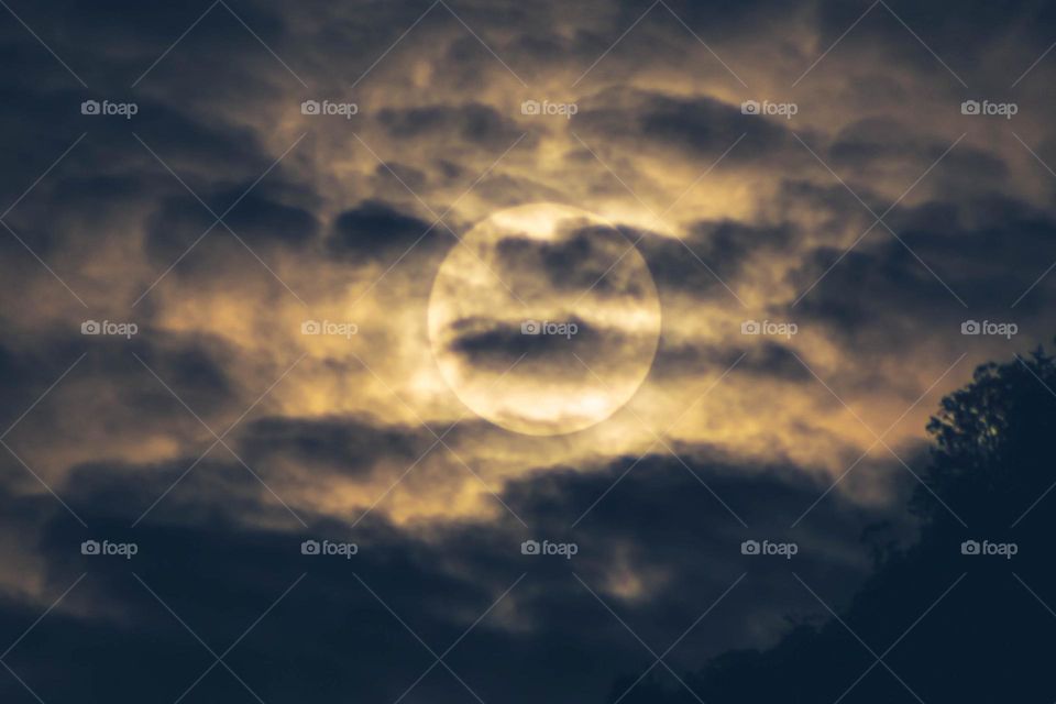 Full moon through clouds
