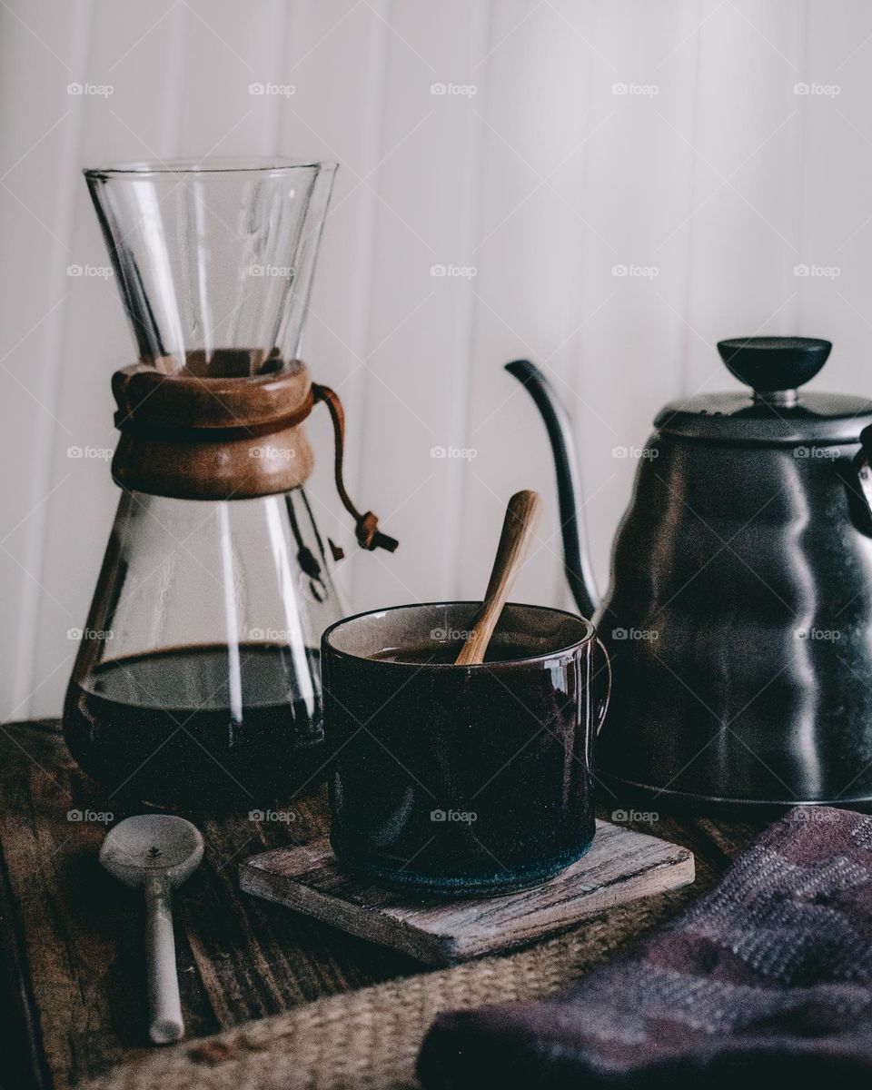 Coffee on the table with chemex and kettle, coffee cup with spoon, cosy mood, coffee photography