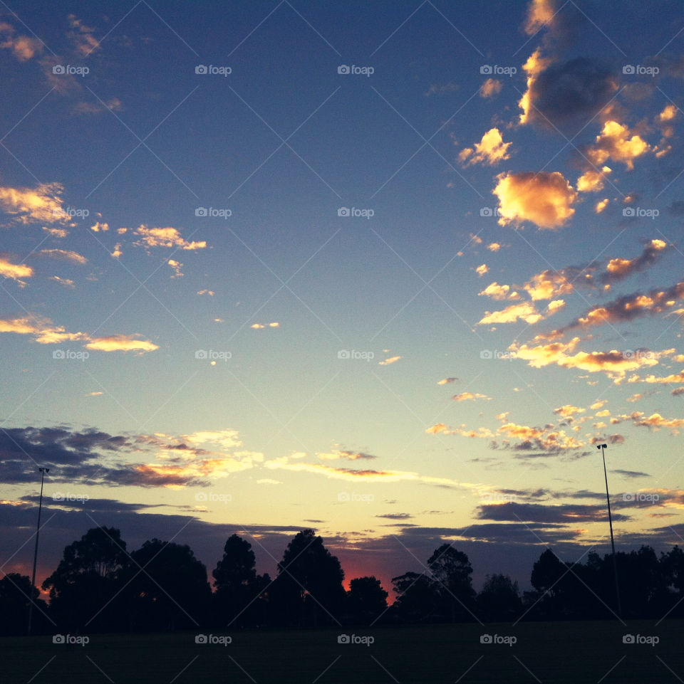 A richly-coloured fading sunset at a park in the suburbs of Melbourne.