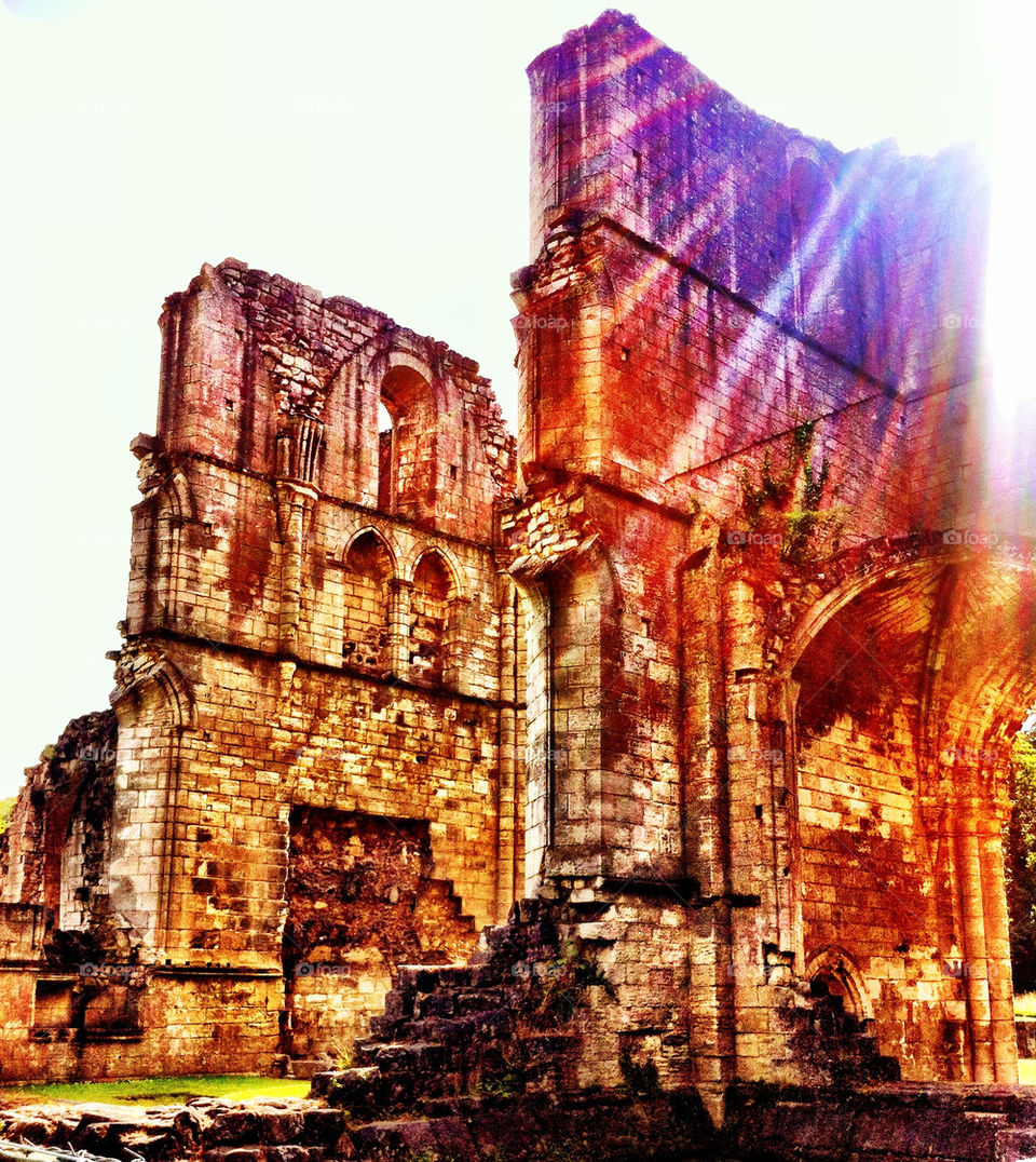 Monastery ruins with sun rays