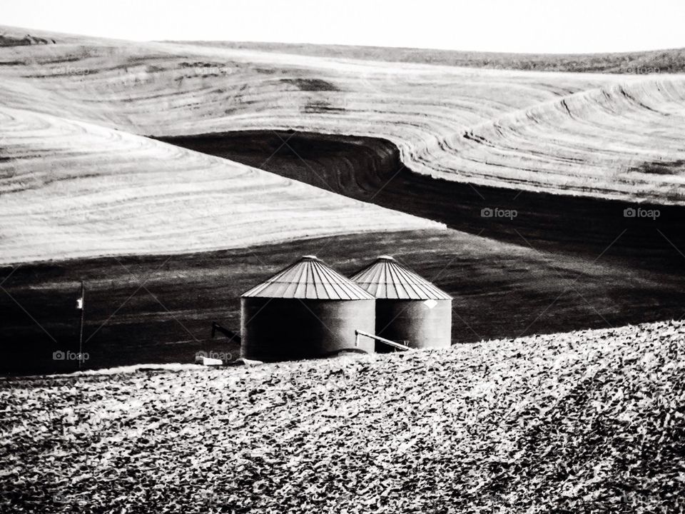Scenic view of silo in field