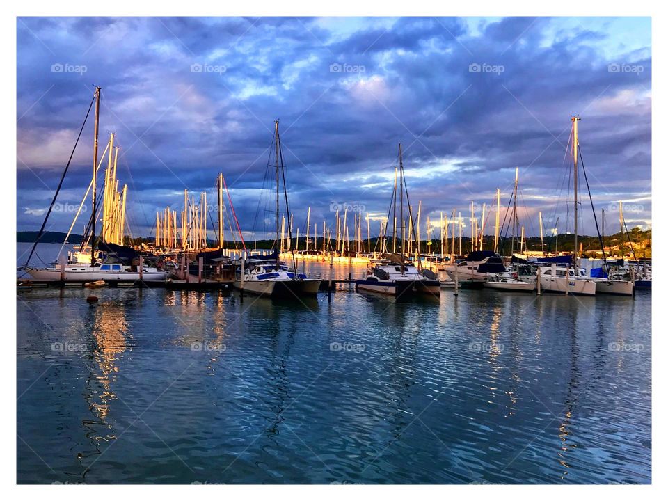 sailboats moored in the marina in Baía de Todos os Santos, Bahia, Brazil and the sky full of clouds