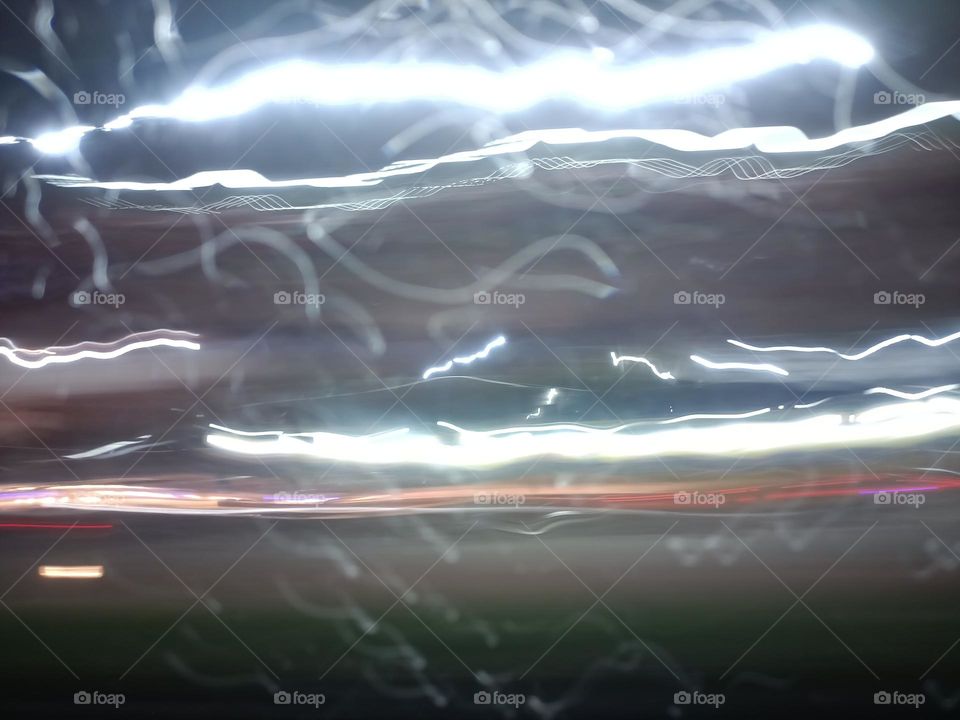 City night lights perspective blurred by high speed of the car. Abstract City night lights. Background and texture.