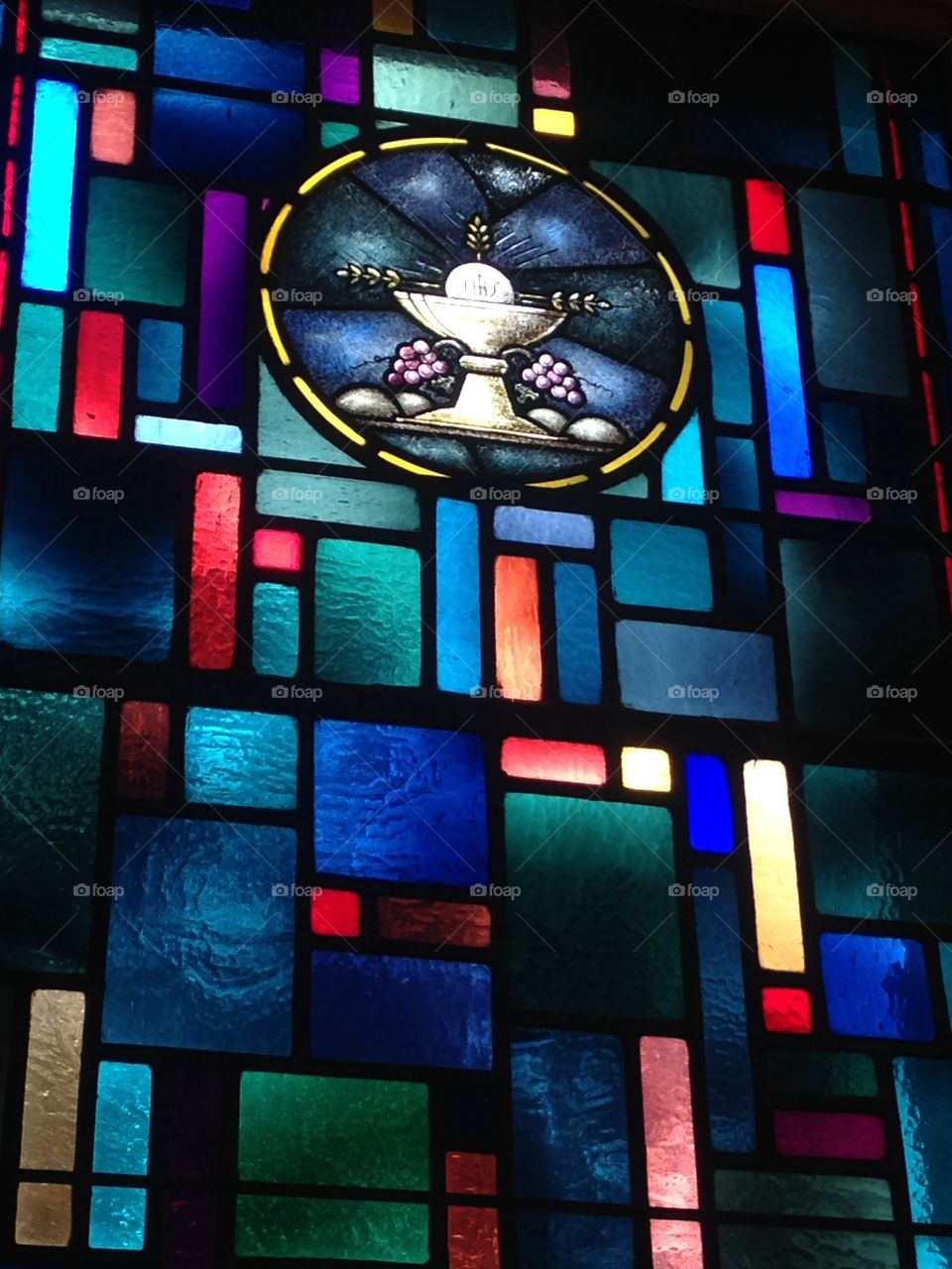 Stain glass of Eucharist and chalice