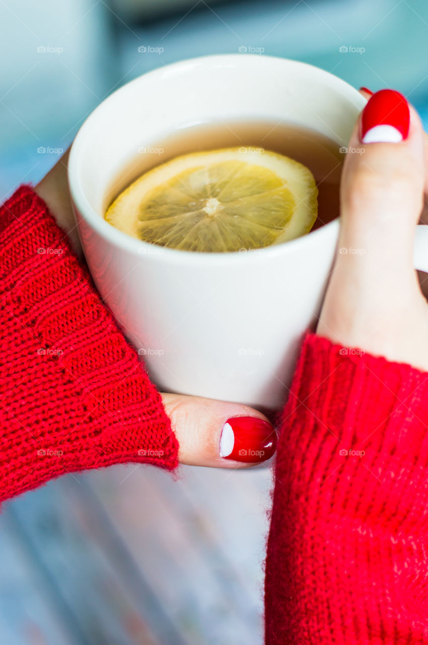 woman hand with cup of tea