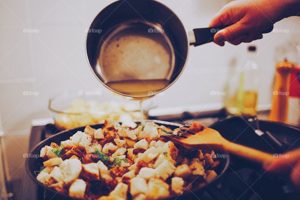 Pouring stock on dish 