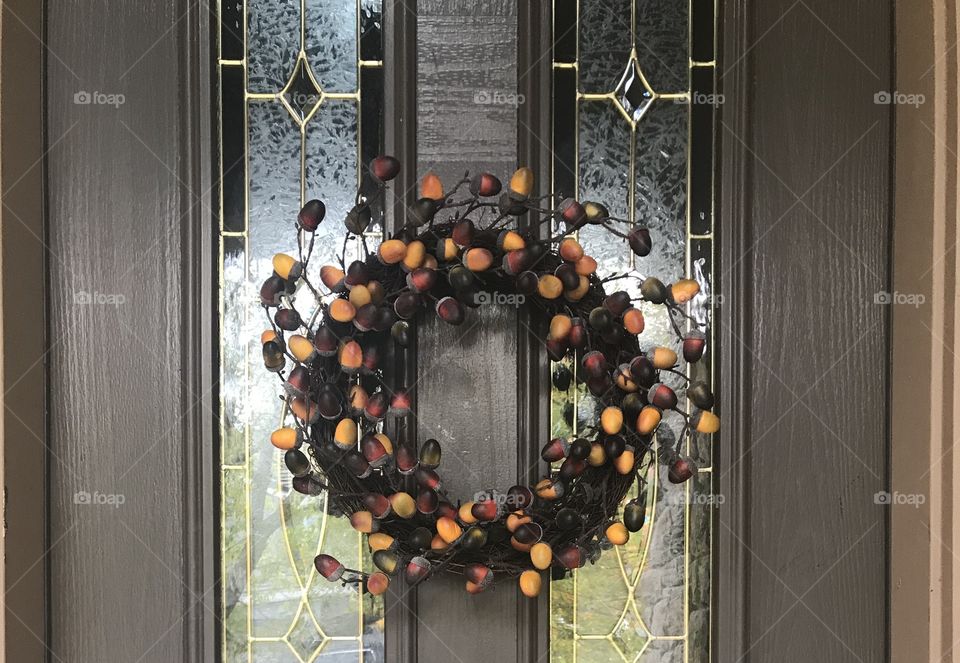 A beautiful fairy and not leave Reese displayed on the front door against a glass window outside of a home. USA, America