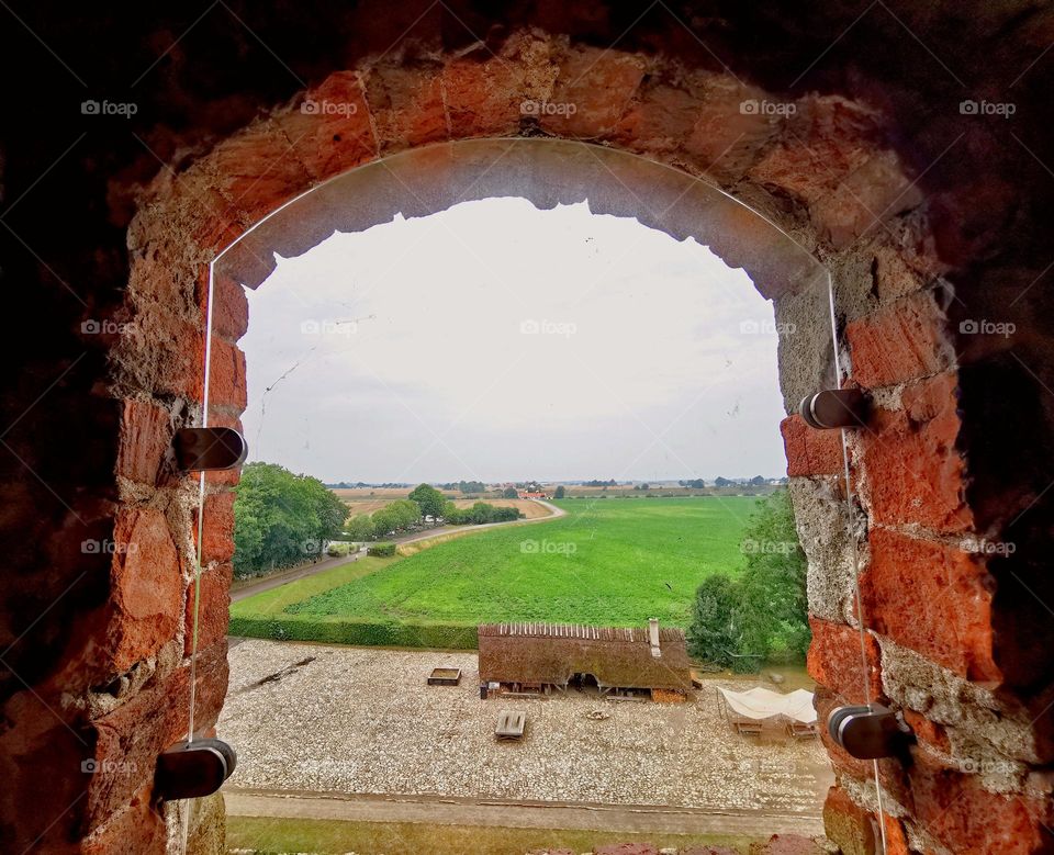 Landscape view through castle window