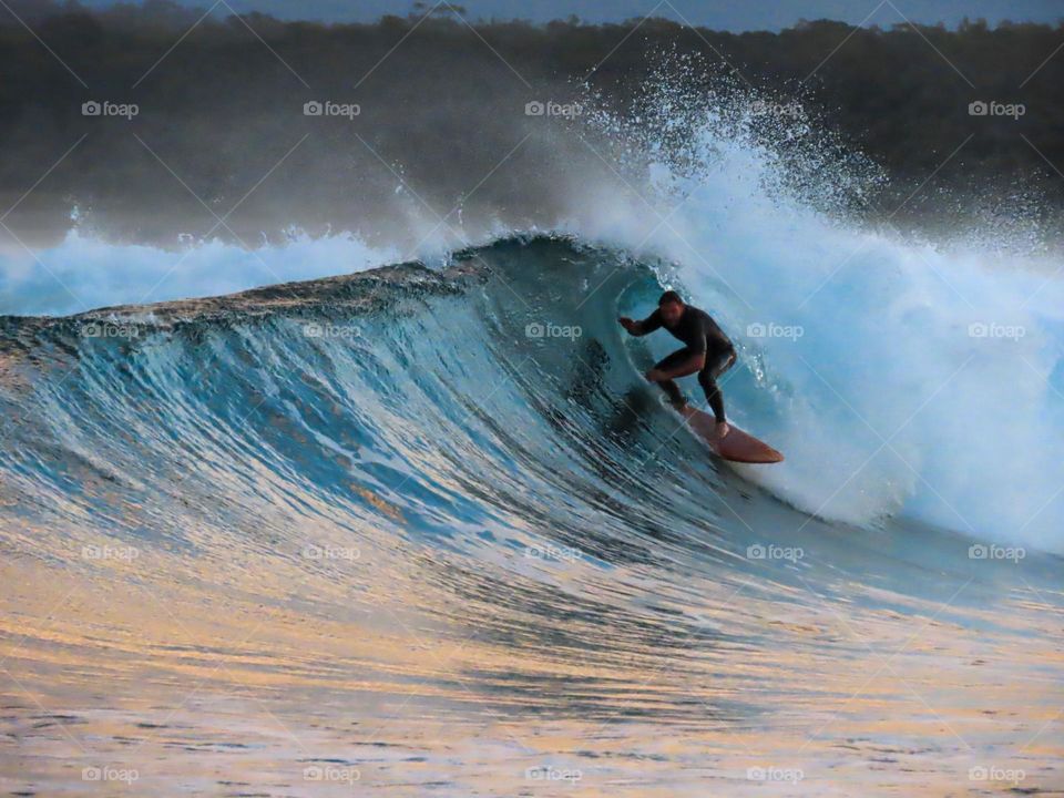 Surfer on a barrel wave 