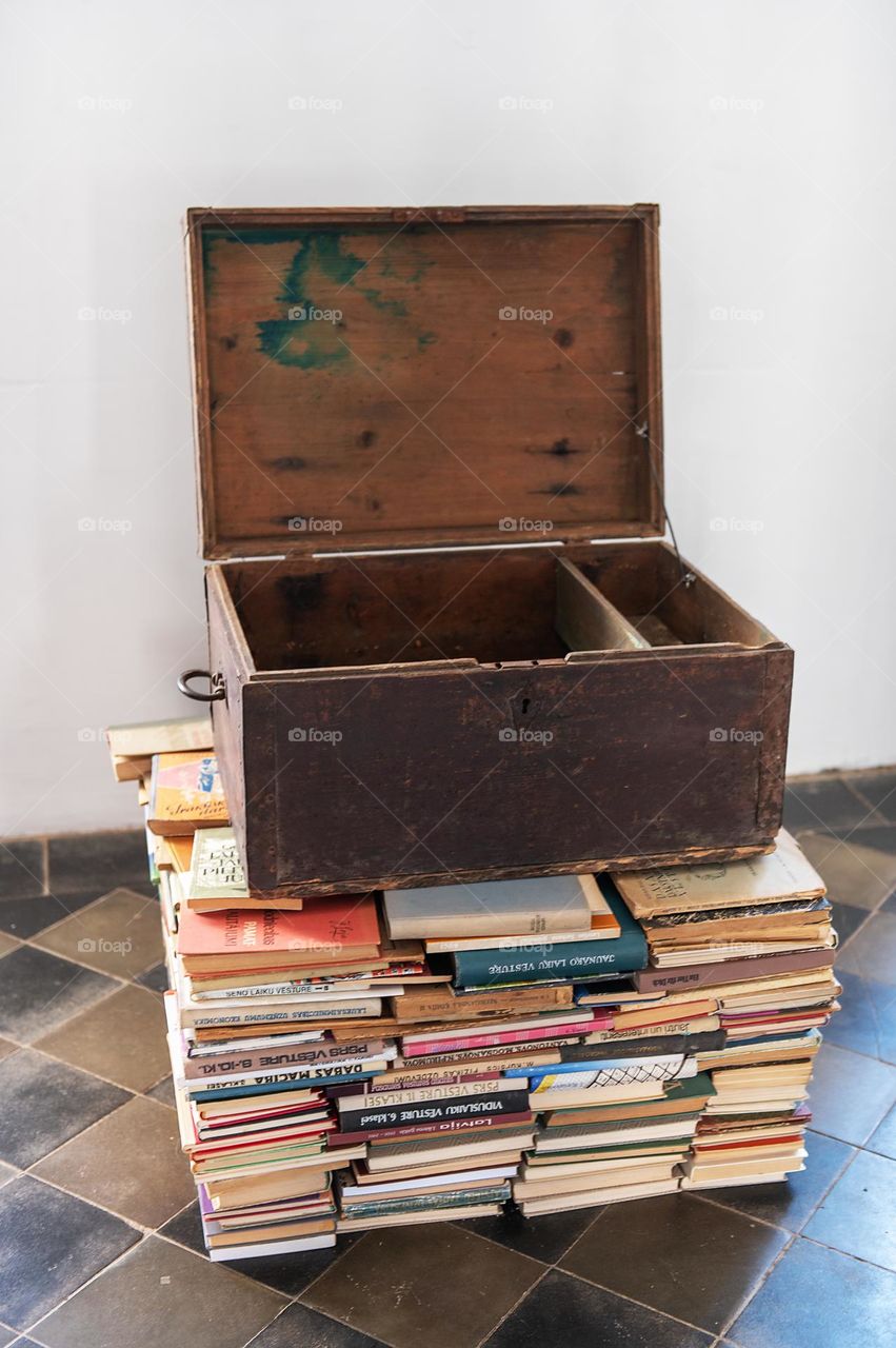 Old wooden chest on a stack of books