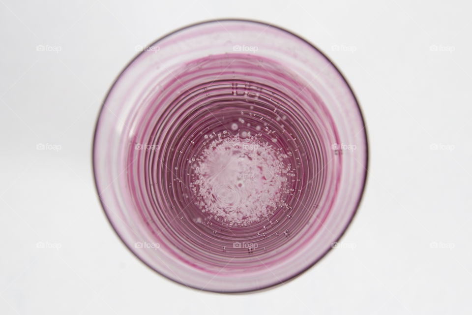 Elevated view of pink drink in glass