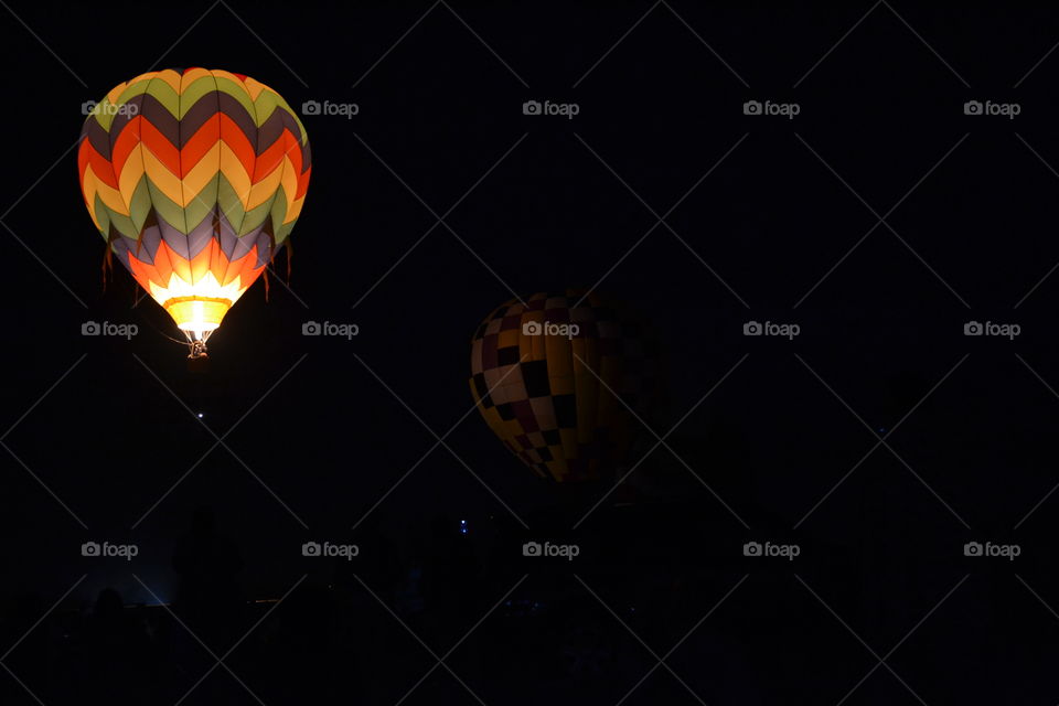 Illuminated colorful hot air balloon at night