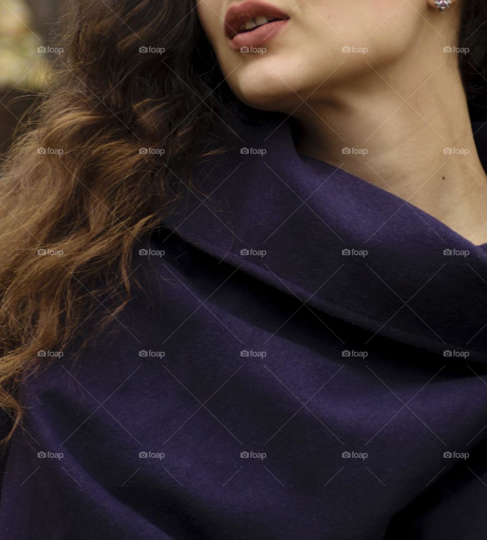Girl with beautiful curly hair in the autumn park.