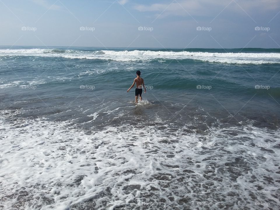 a boy alone in beach