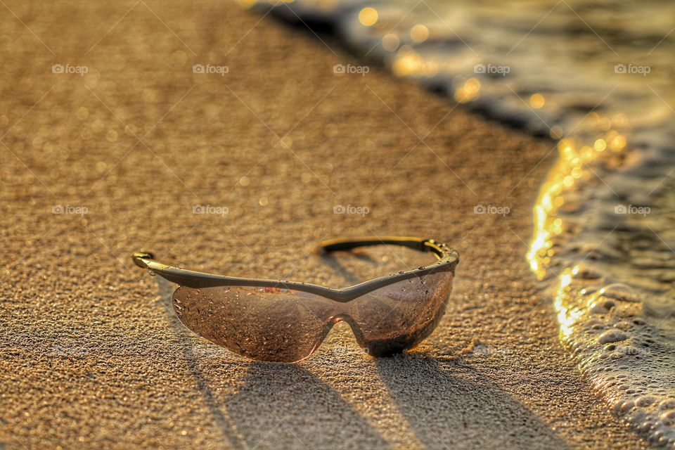 sunglasses under sand