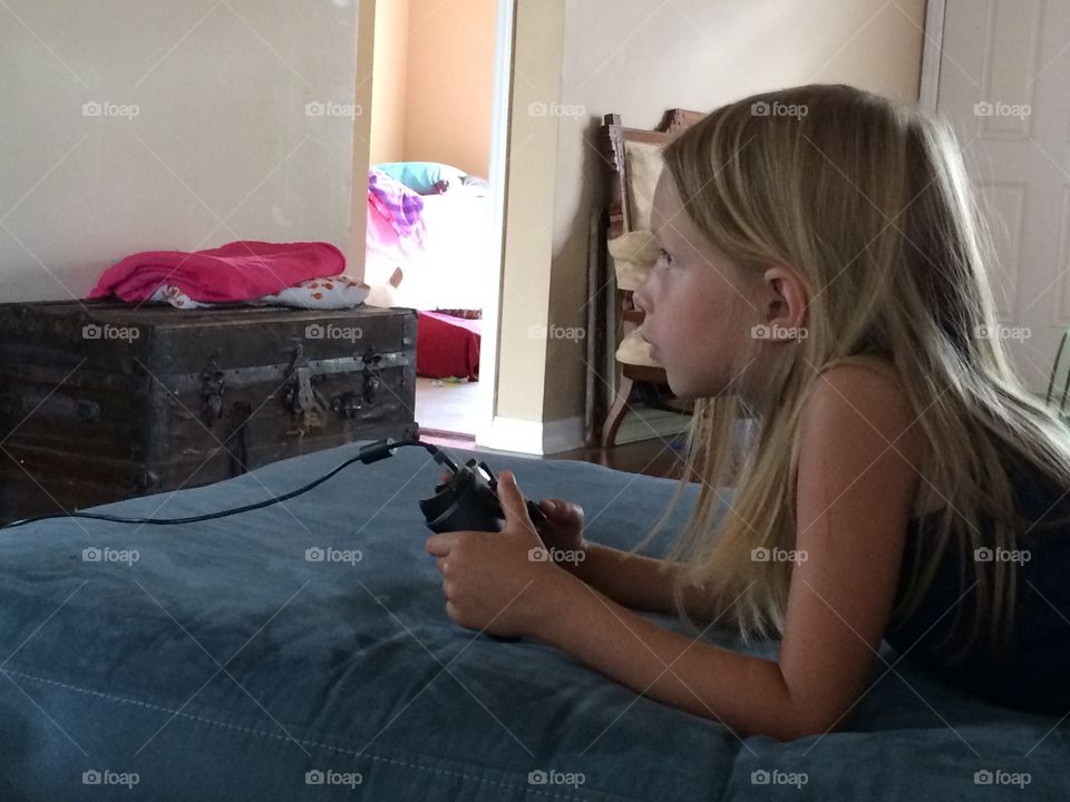 Little girl playing xbox one