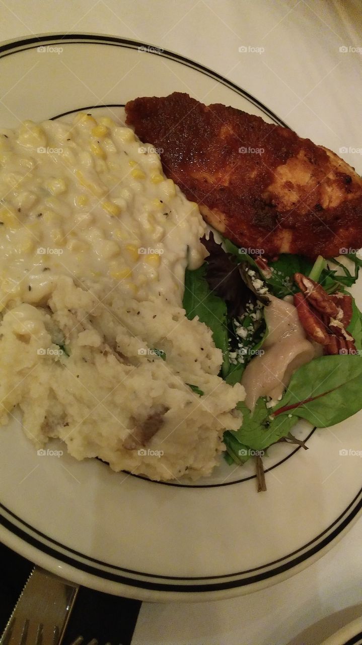 Chicken meal with a side salad