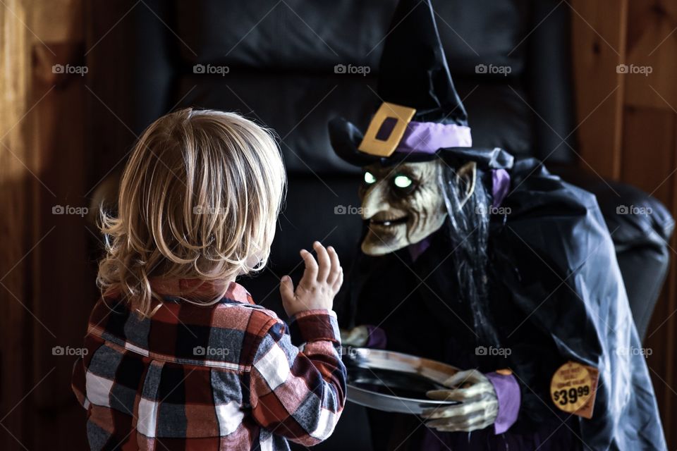 Halloween is for kids! Here’s my nephew who loves and adores witches! He’s not scared at all with all these halloween decors!