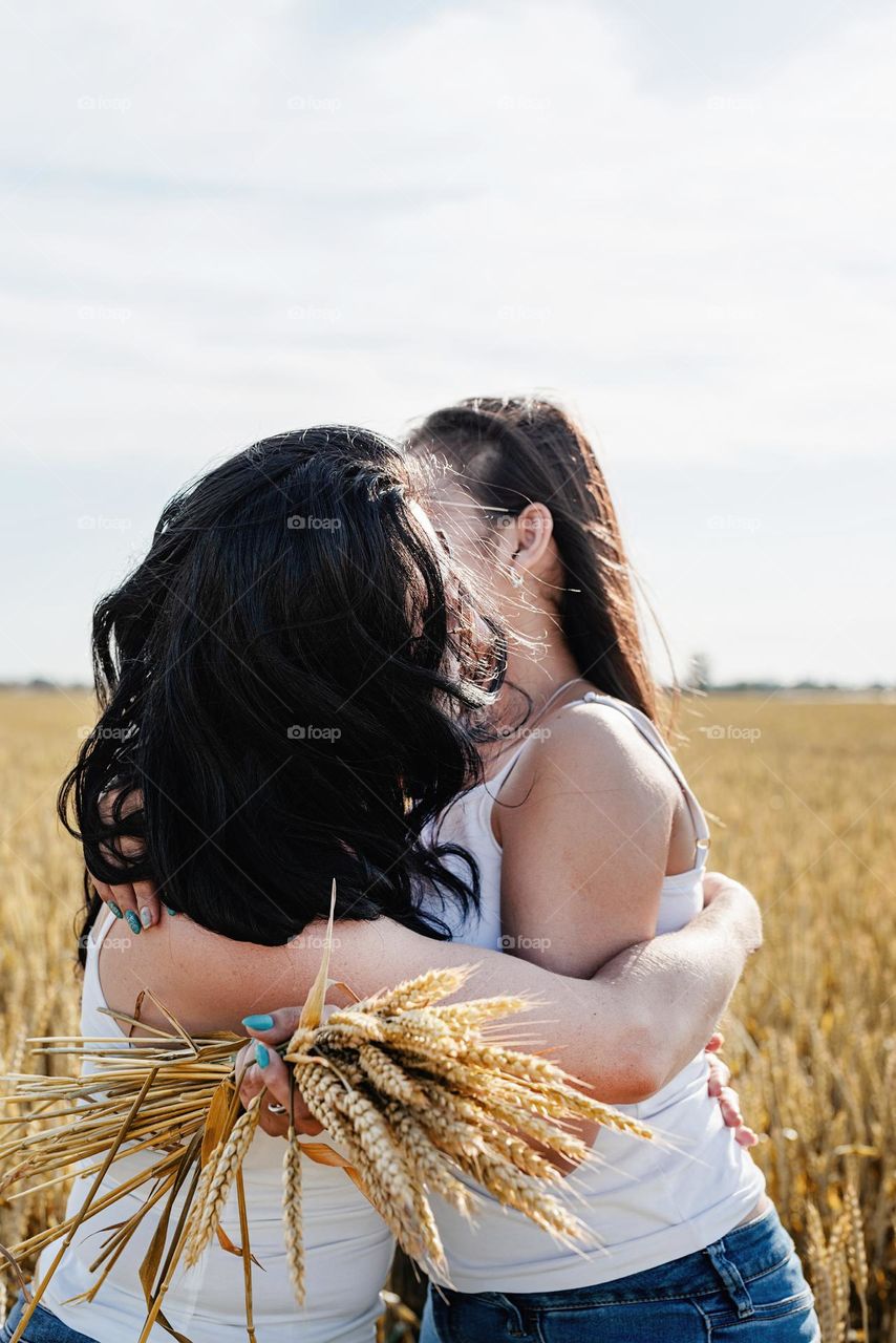 two female friends hugging