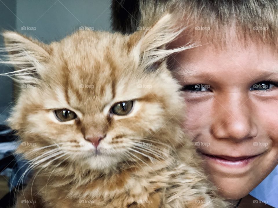 Cute boy with cat