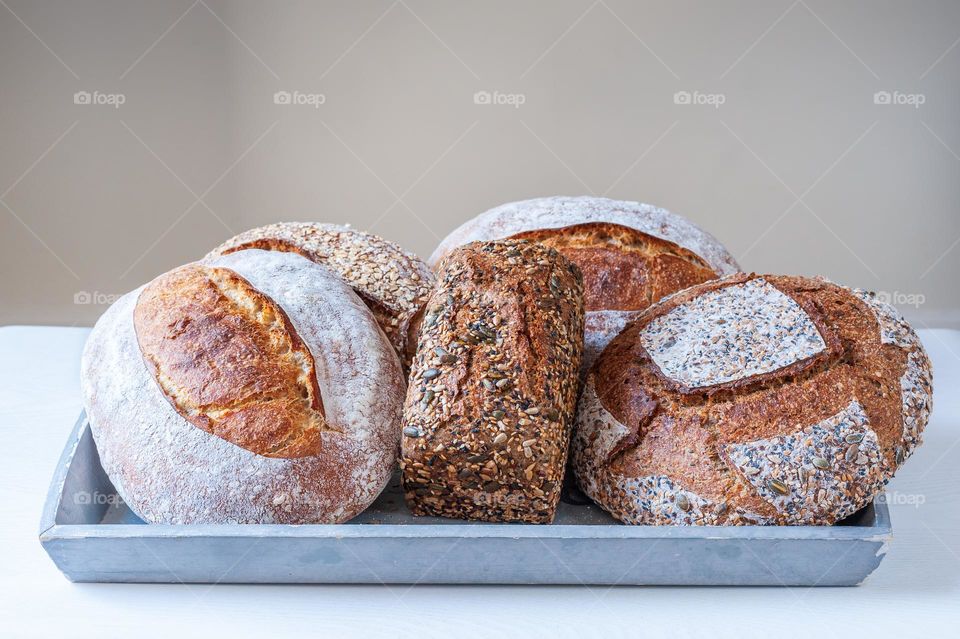 Selection of freshly baked organic sourdough loafs of bread.