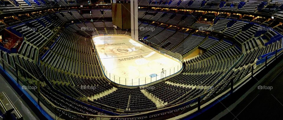 Empty Hockey Arena. Panoramic of empty arena with hockey rink. 