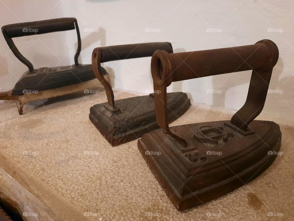 Set of three antique cast irons