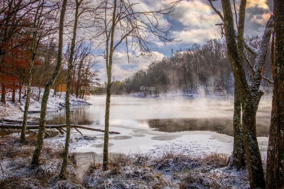 All three forms or phases of water in one frame, and each in white: solid (ice & snow), liquid (lake water), and vapor (mist & clouds). Grundy Lakes Park, Tracy City, Tennessee.