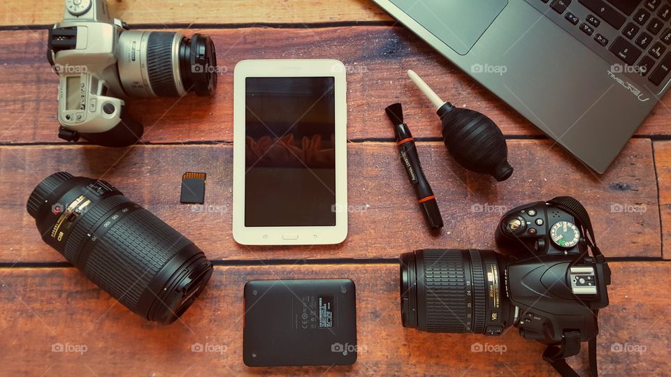 Photography equipment on a rustic wooden table