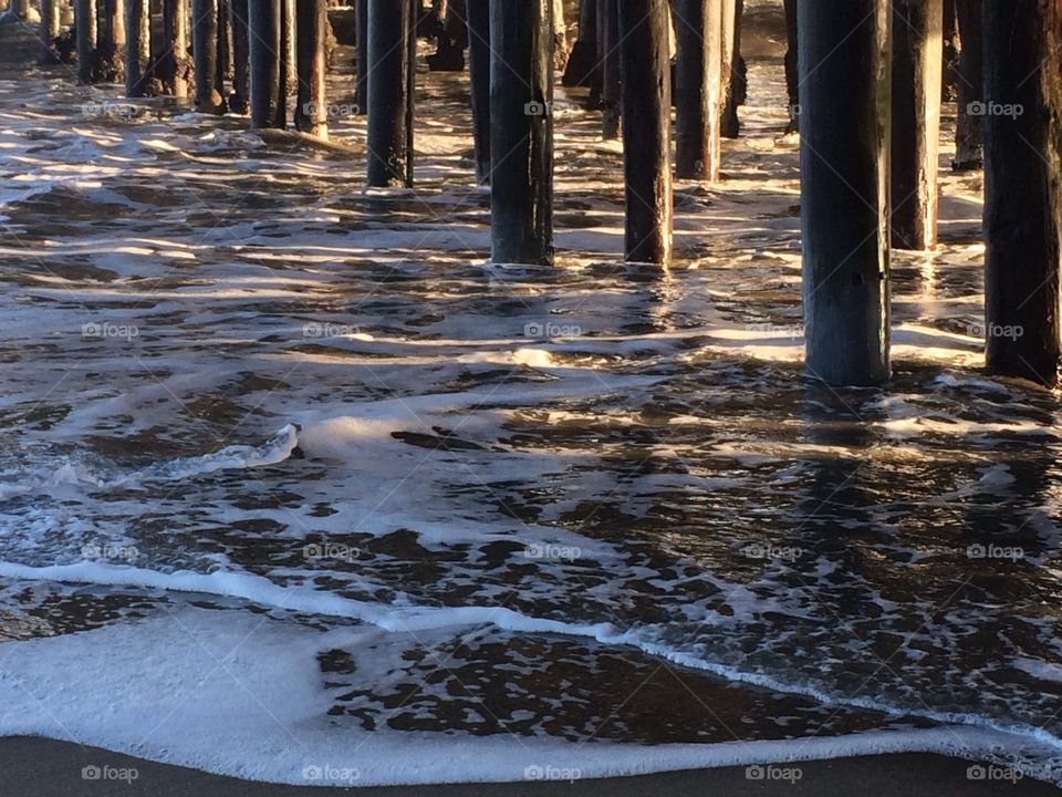 Wooden post under the pier