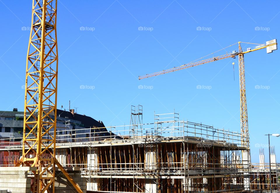 Building under construction. Building under construction with cranes in the city