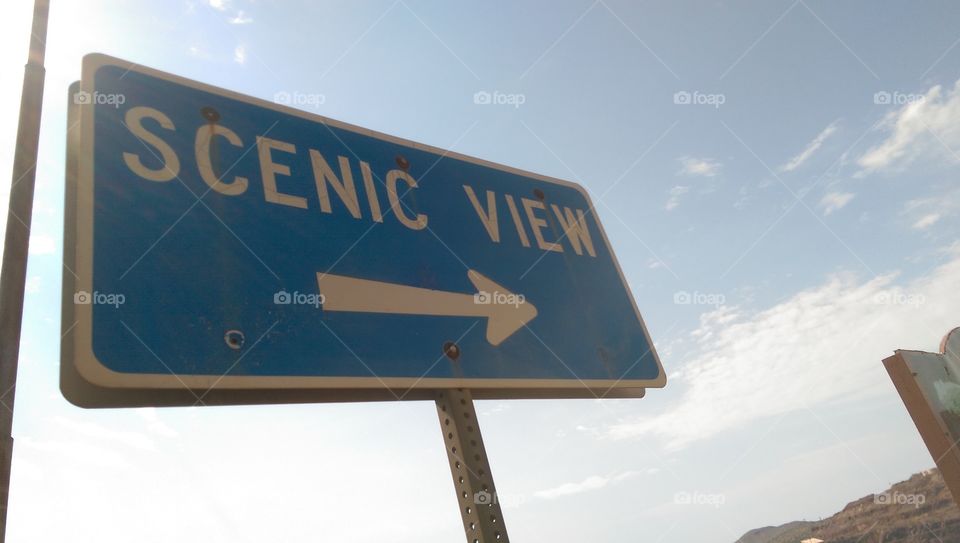 Scenic view sign with sky