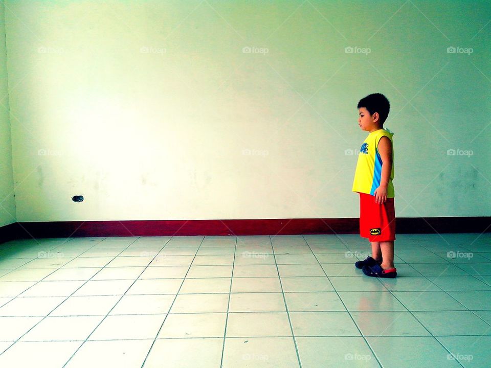 Little boy in an empty room