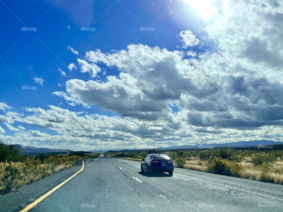 Blue sky with white clouds at the country road